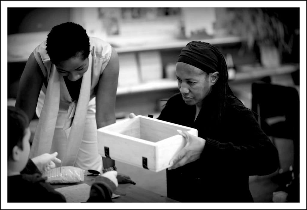 A teacher working with a student