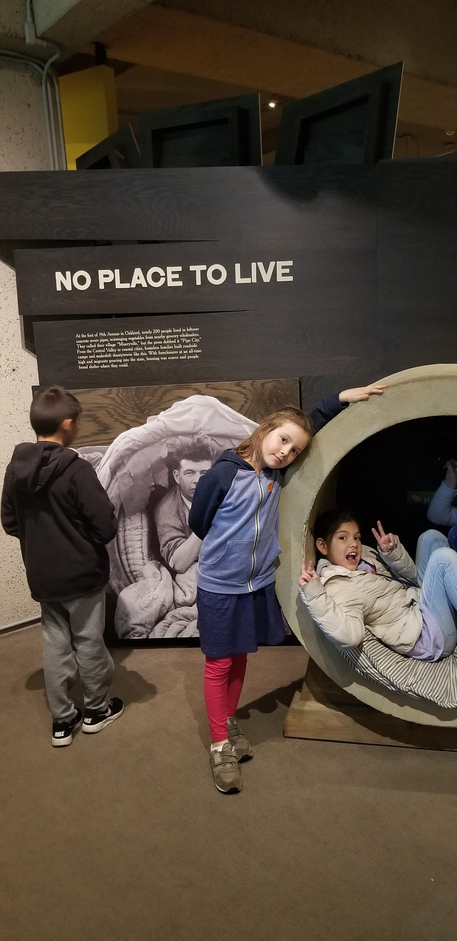 MEISA students at a museum exhibit on housing and homelessness in the Bay Area