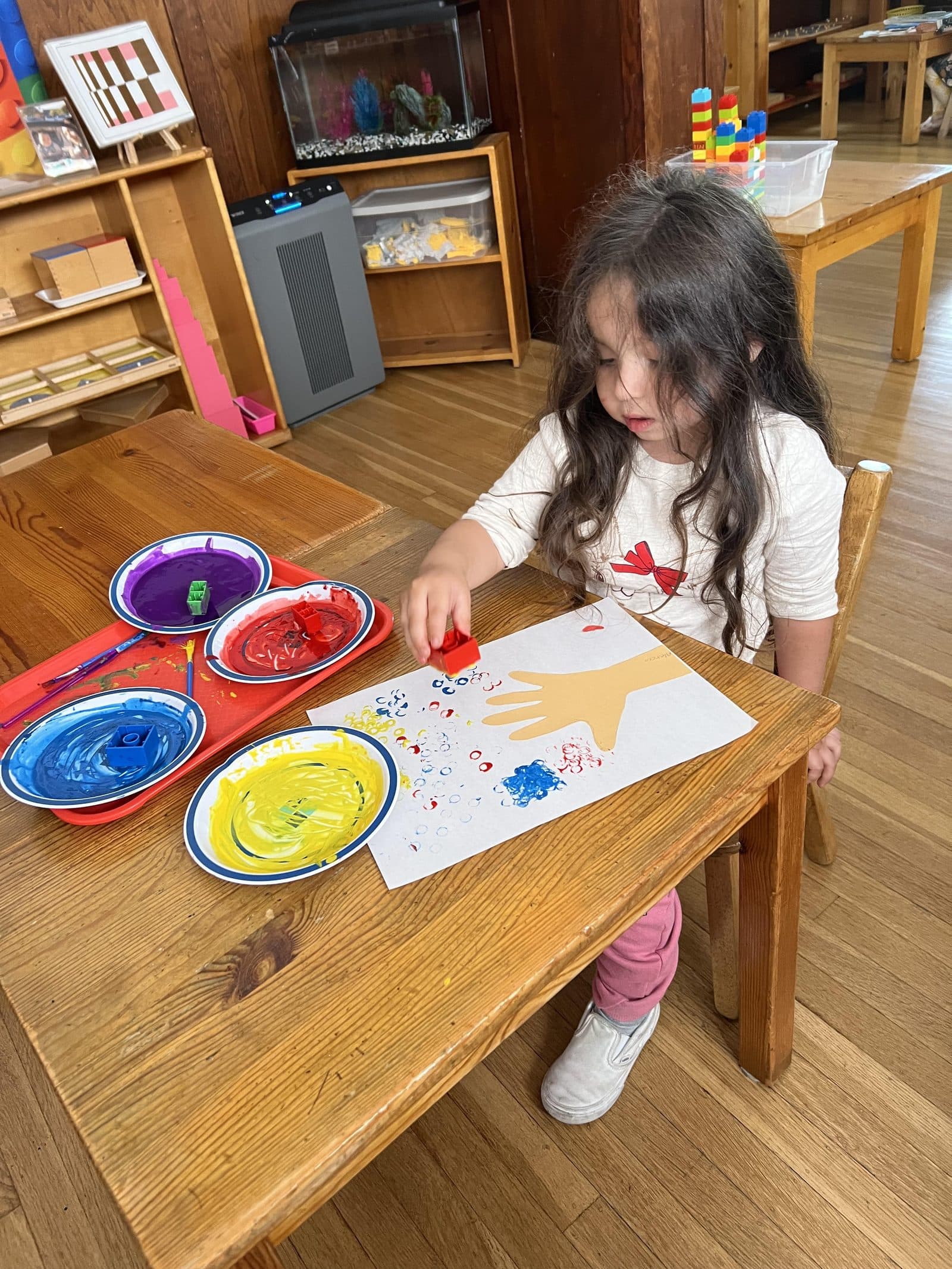 Children doing art at The Child Unique Montessori Schools